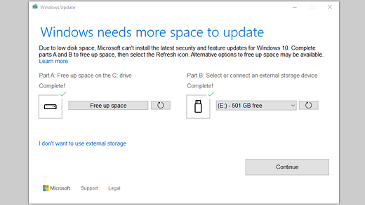 Windows Update reports it needs more space and offers internal cleanup or external storage.